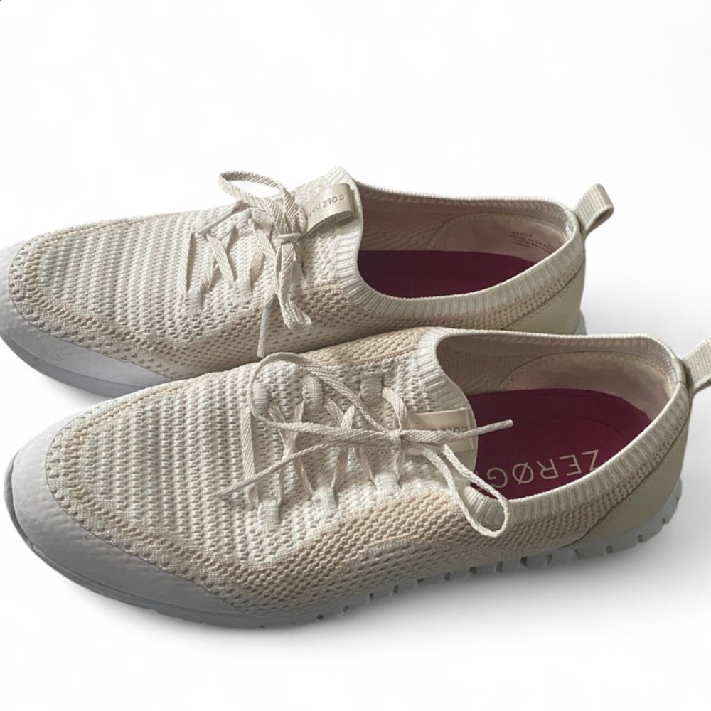 Beige and white Cole Haan ZERØGRAND lace-up shoes.